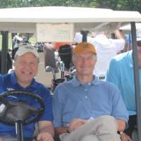 men in golf cart